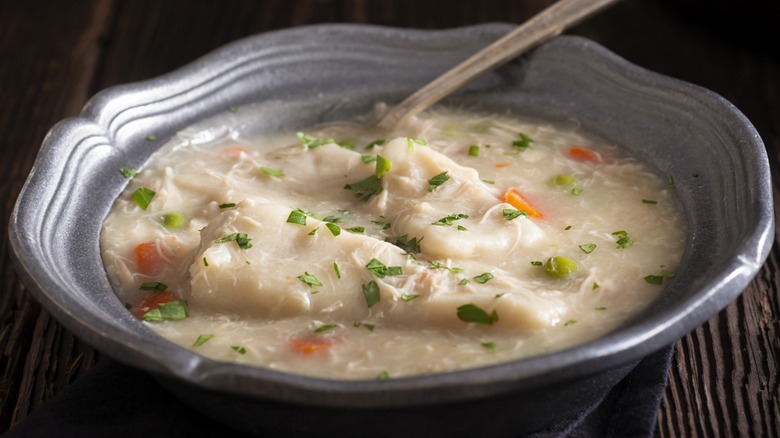 Chicken and dumplings in a gray bowl