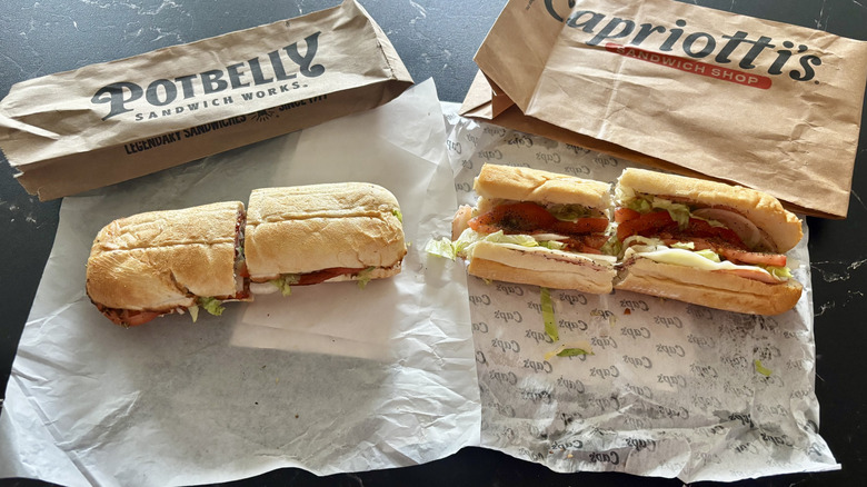 Potbelly and Capriotti's Italian sub sandwiches on wrappers with brown bags in background