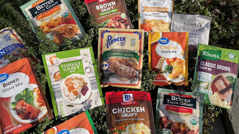 Assorted gravy packets on background of thyme