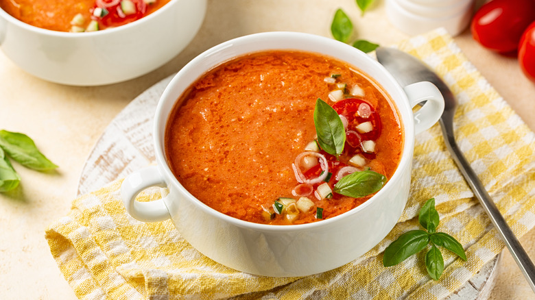 Gazpacho garnished with diced tomatoes and cucumber