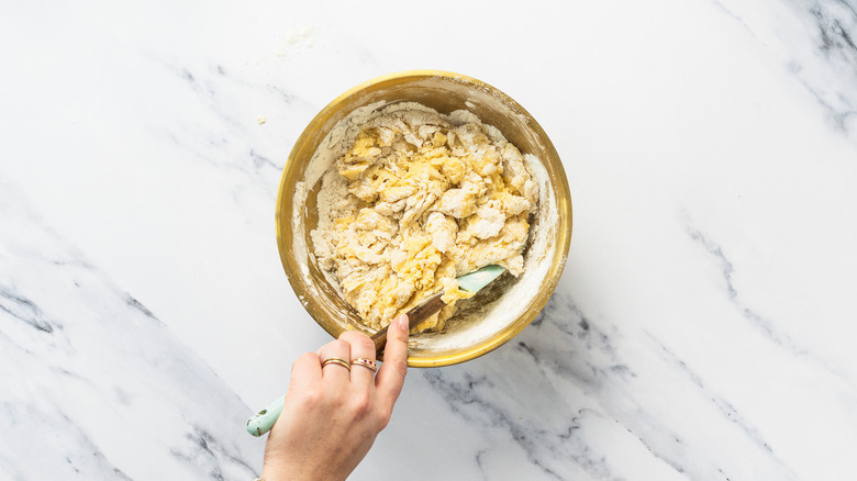 Mixing cinnamon bun dough.