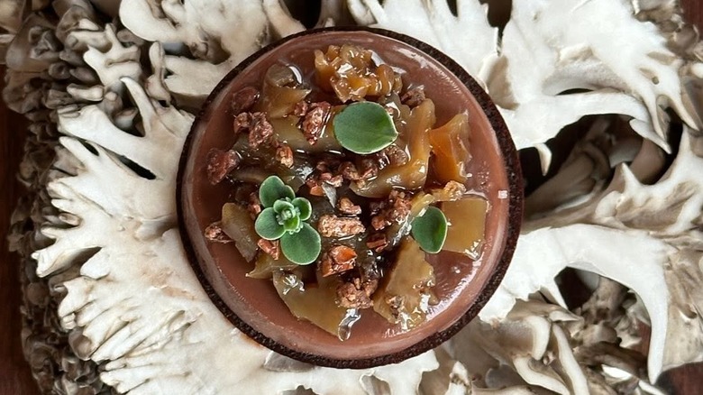 Dish made with chanterelle ganache, chocolate wafer, candied maitake, and marjoram at Smyth