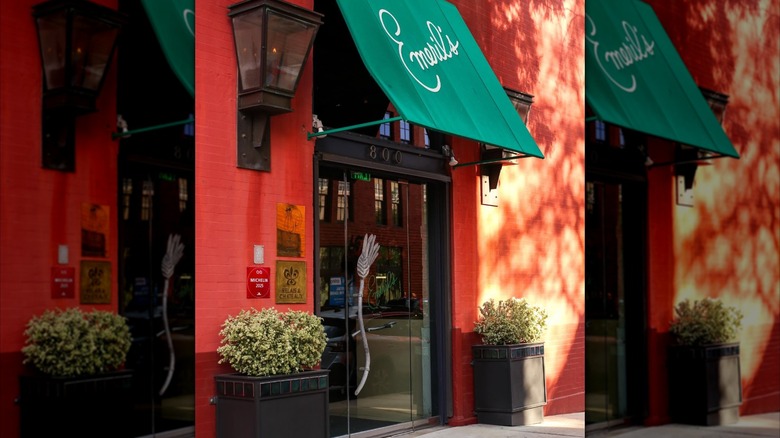 Exterior view of Emeril's with potted plants