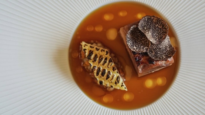 Guinea hen, chanterelle, silver queen, and black truffle course at Vestige