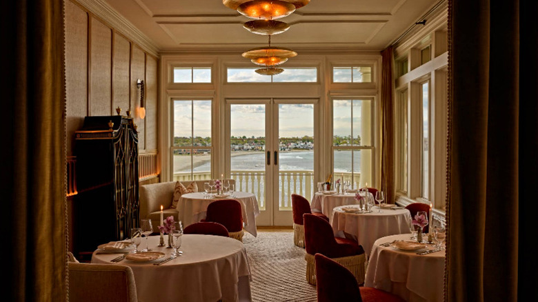 Dining room with a beach view at Cara at The Chanler