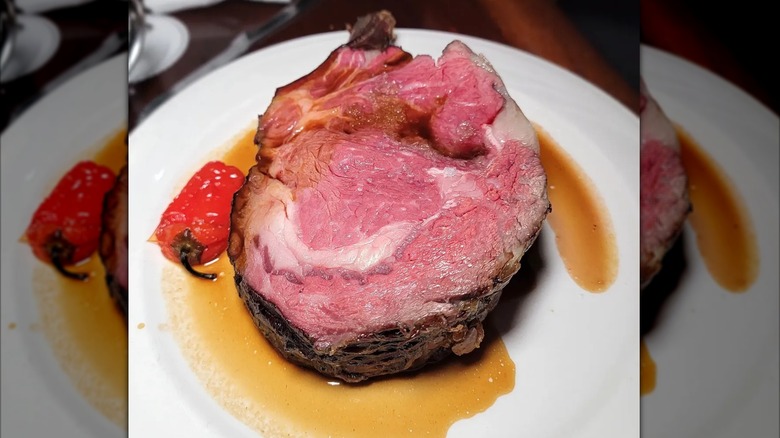 Prime rib on white plate at Keens Steakhouse