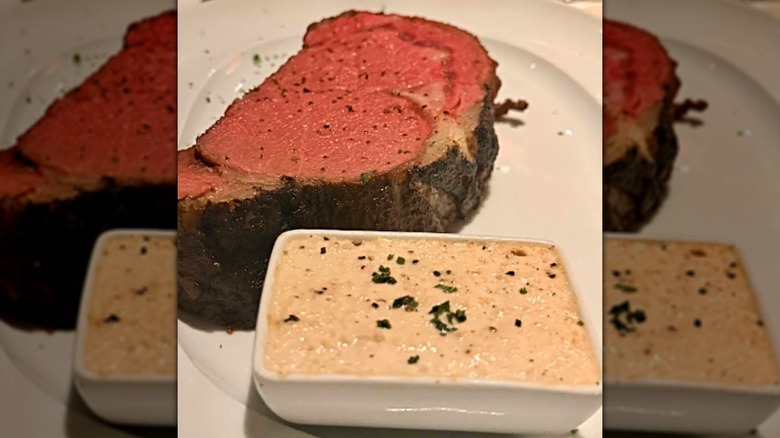 Prime rib with sauce at Durant's Steakhouse