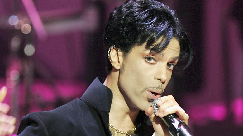 Artist Prince singing at a concert