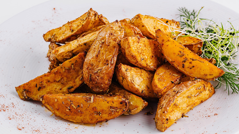 roasted potato wedges with spices and herbs