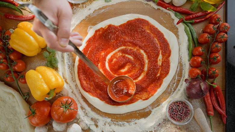 Preparing a homemade pizza