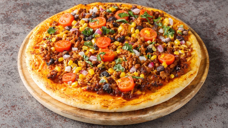 Tex-Mex taco-style pizza on wood tray