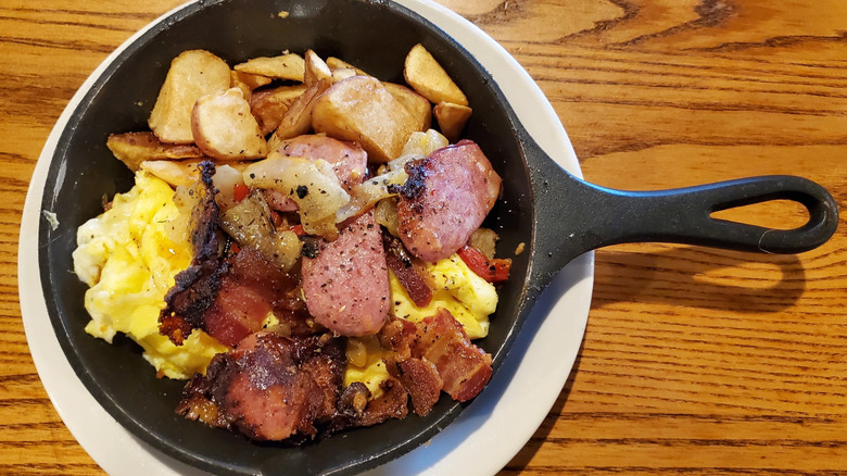 Cracker Barrel Campfire Breakfast Skillet with scrambled eggs, smoked sausage, and bacon