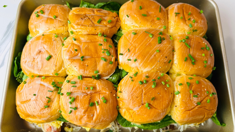 Buttered brioche sandwiches topped with chives