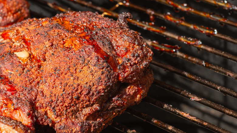 Close-up of pork shoulder picnic roast on a grill