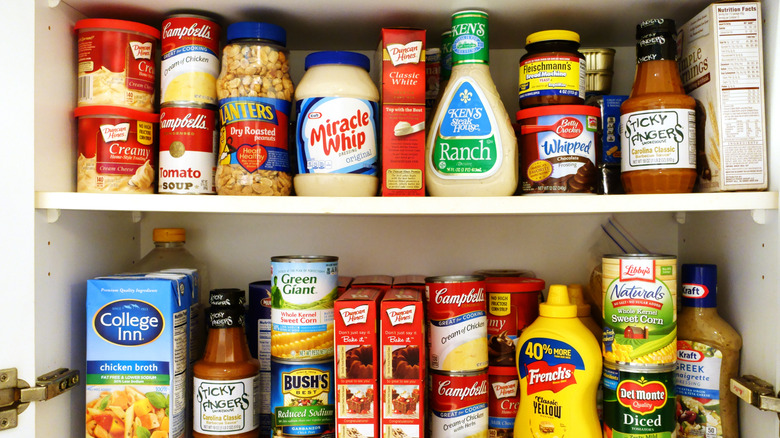 A cupboard stocked with pantry staples