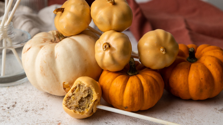 pumpkin-shaped cake pops with gourds