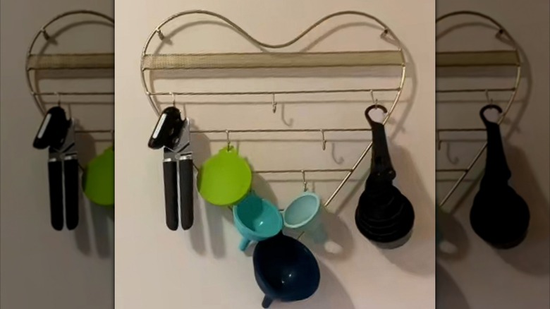 Jewelry organizer on wall with kitchen tools