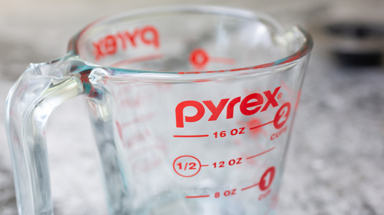 Closeup of pyrex glass measuring cup on a table