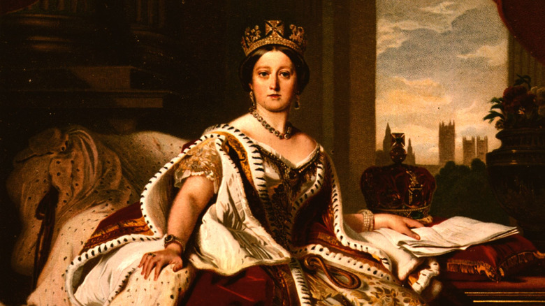 Queen Victoria poses in royal robes for a painted portrait.