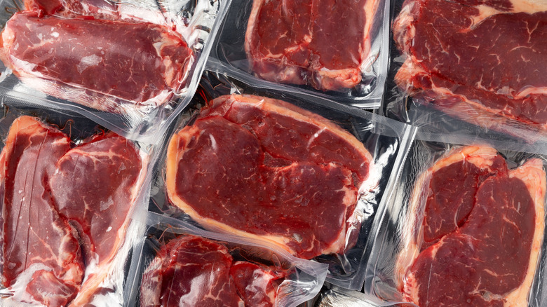 Different cuts of fresh beef steaks packaged in plastic