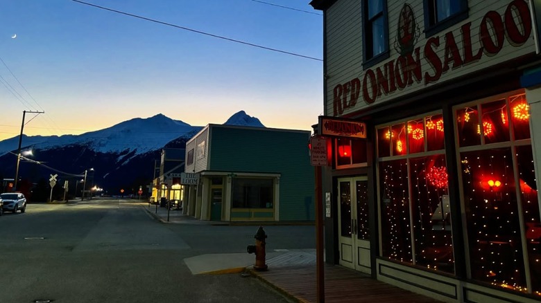 Front of the Red Onion Saloon at night with red lights