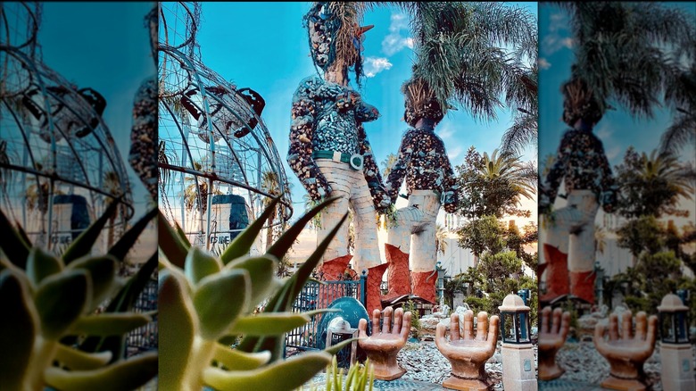 Very tall recycled art statues with hand chairs