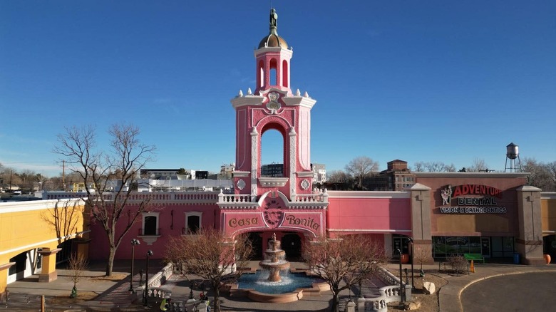 Casa Bonita exterior, a bright pink building with a fountain