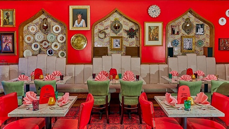 Bright red and green dining room with vintage decor