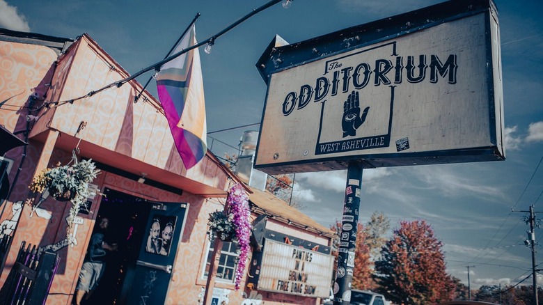 Exterior and sign in front of The Odd on a sunny day