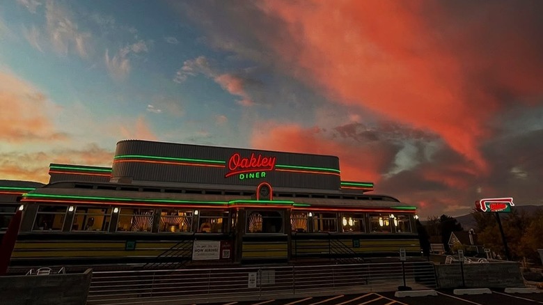 Oakley Diner exterior against a brightly colored sky at dusk