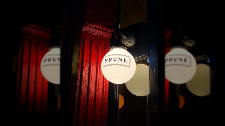 Frosted light fixture printed with the Prune logo outside of Hamilton's East Village restaurant