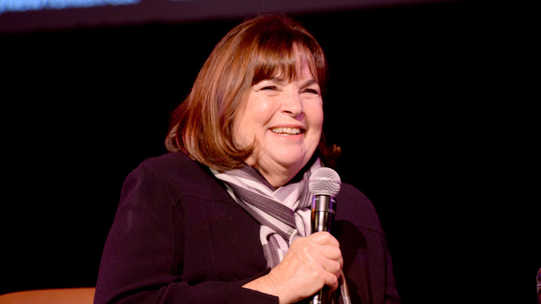Ina Garten with a microphone speaking on stage