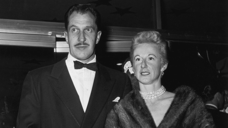 Black and white photo of Vincent Price and his wife Mary Price at a glamorous event, both in evening dress