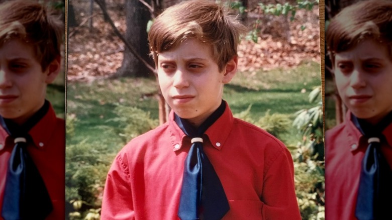 David Lebovitz as a child in a red long sleeve shirt and blue necktie