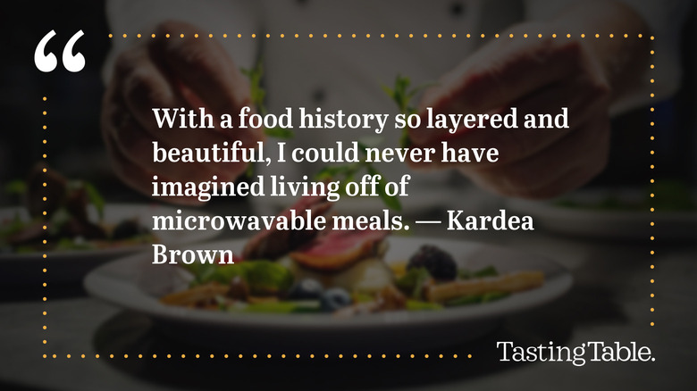 A quote by Kardea Brown with a chef preparing a plate in the blurred foreground. The quote reads: "With a food history so layered and beautiful, I could never have imagined living off of microwavable meals."