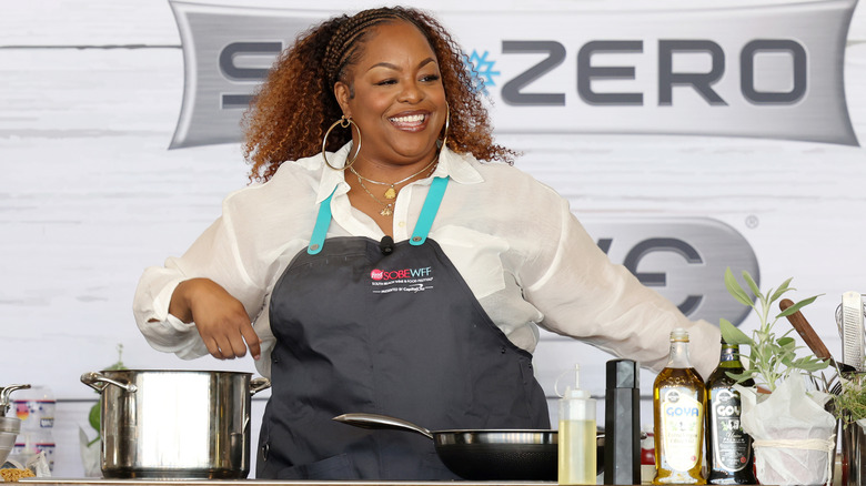 Kardea Brown conducting a food demonstration at The Food Network South Beach Wine & Food Festival in 2024