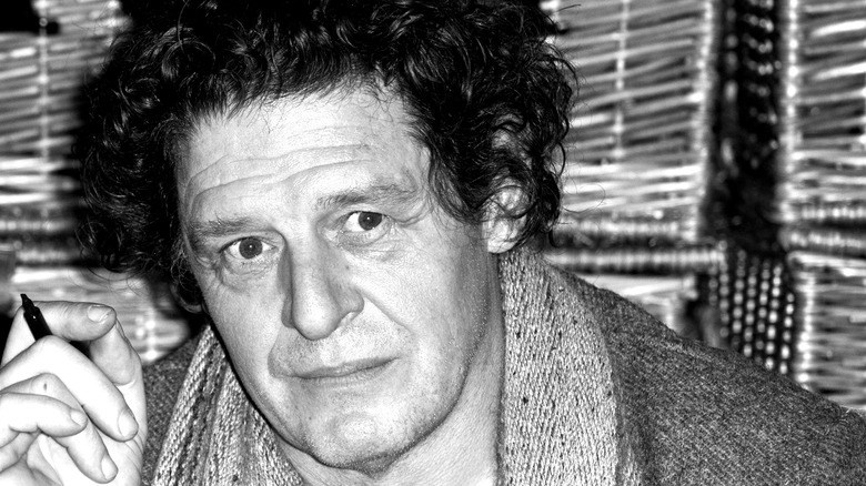 A black and white headshot of Marco Pierre White.