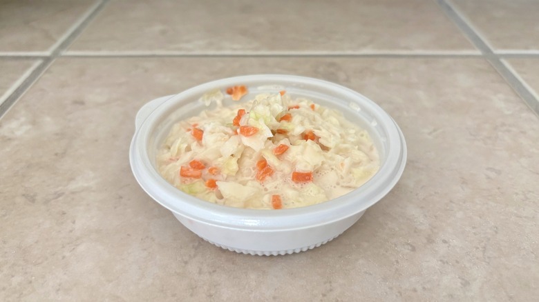 green and orange cole slaw on tile table