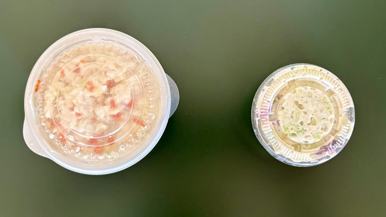 two cole slaw sides on green table