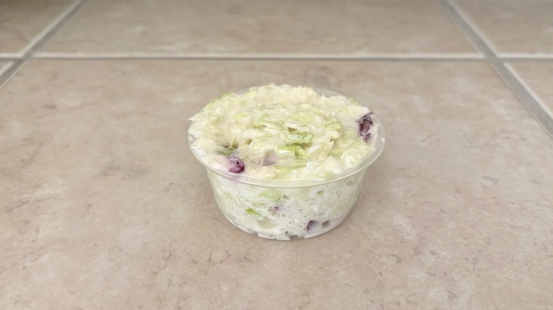 green and purple cole slaw on tile table