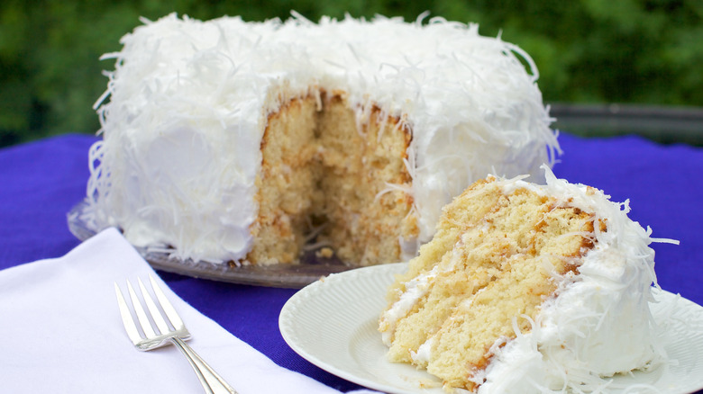 Coconut cake covered in meringue and shavings