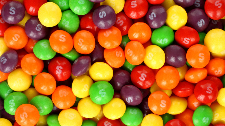 a heap of unpackaged Skittles
