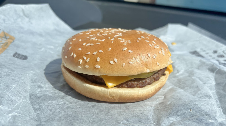 Burger King Cheeseburger with a paper wrapper