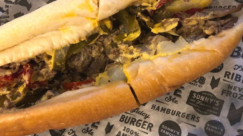 A cheesesteak from Sonny's Famous Steaks full of peppers, steak, and onions