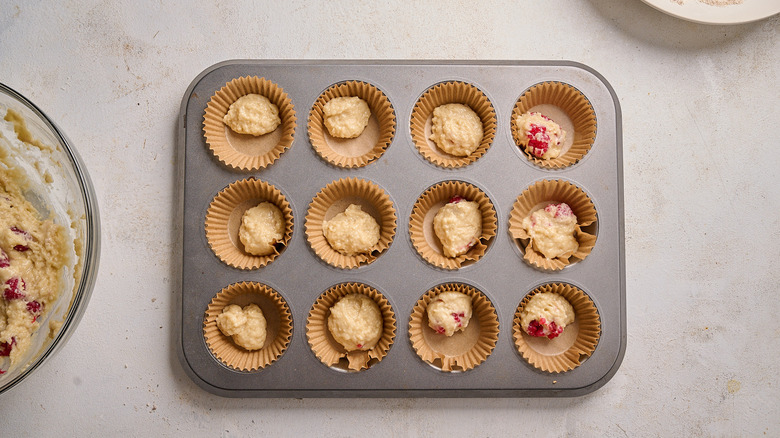 muffin cups filled with batter