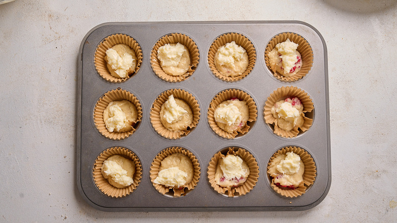 cream cheese added to muffin cups