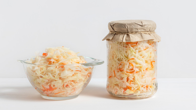 bowl and jar of raw sauerkraut