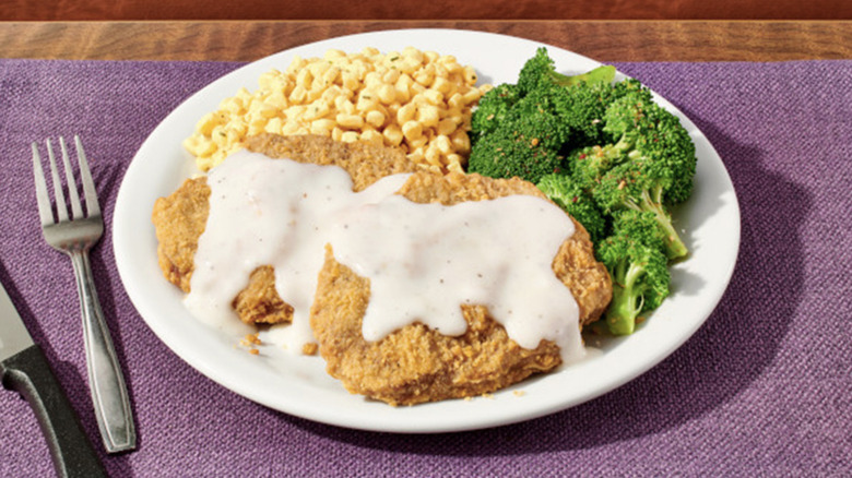 Denny's chicken-fried steak dinner with corn and brocolli
