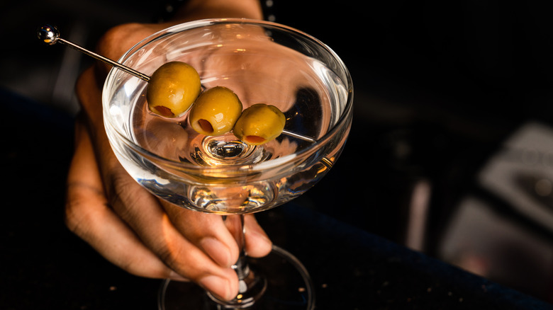 martini garnished with olives