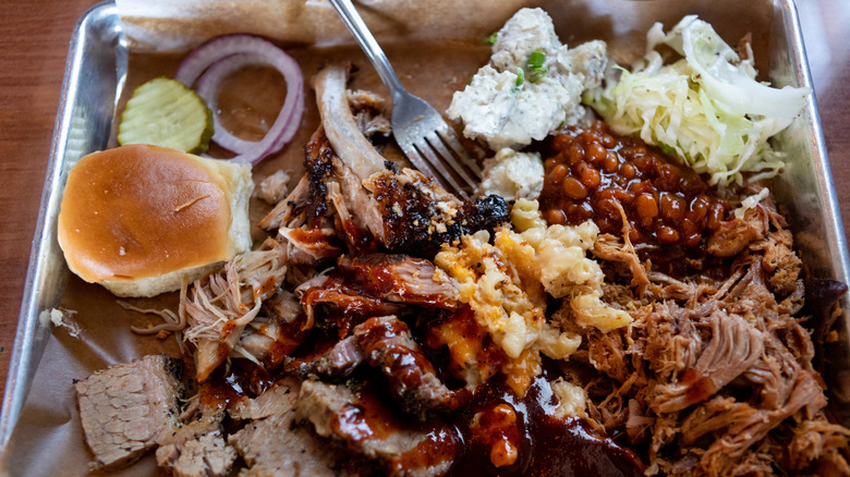 A full bbq restaurant tray with meat and fixins